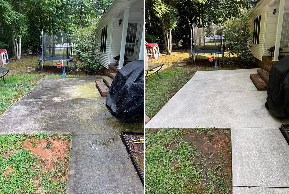 Side-by-side comparison showing a concrete patio before and after pressure washing, with the right side clean and the left side dirty with moss and stains.